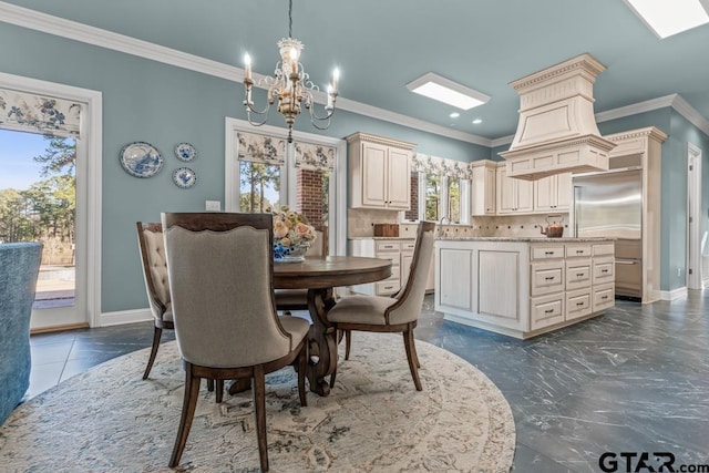 dining room with ornamental molding and a chandelier