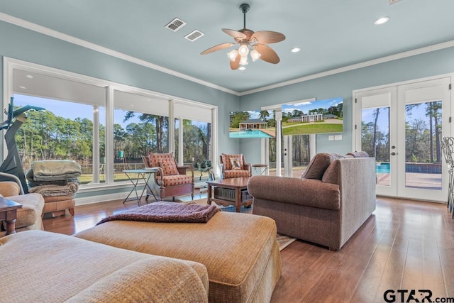 bedroom with light hardwood / wood-style flooring, french doors, access to exterior, and ornamental molding