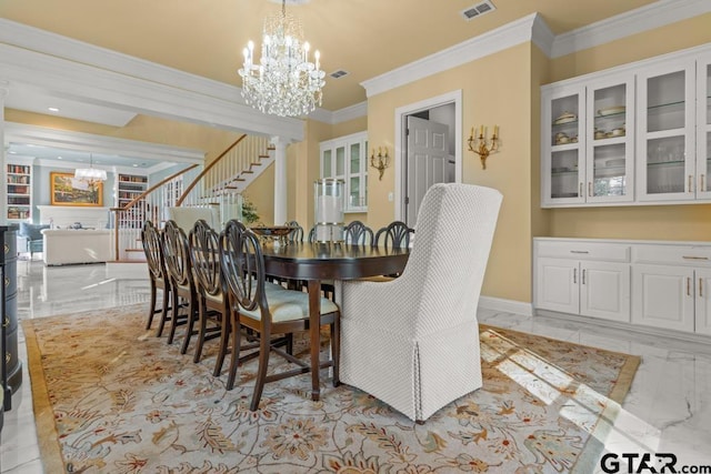 dining area featuring a notable chandelier and ornamental molding