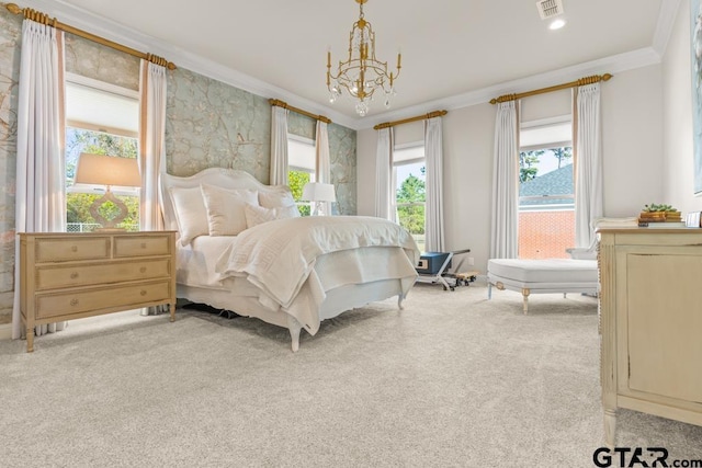 carpeted bedroom featuring a chandelier and crown molding