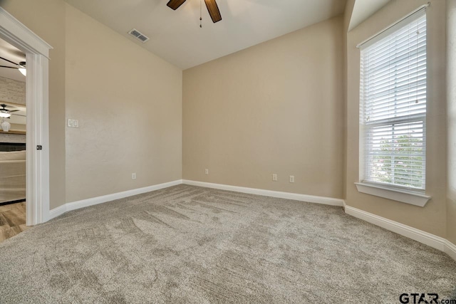 empty room featuring light carpet