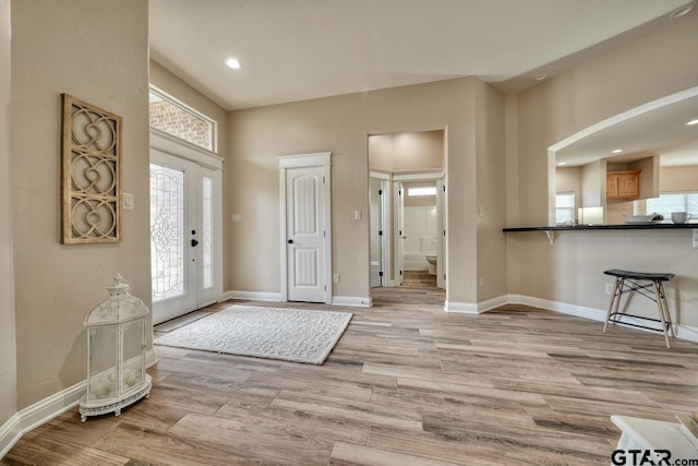 foyer entrance with light hardwood / wood-style flooring