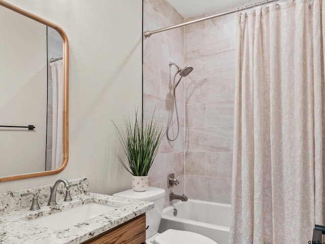 bathroom featuring shower / bath combination with curtain, toilet, and vanity