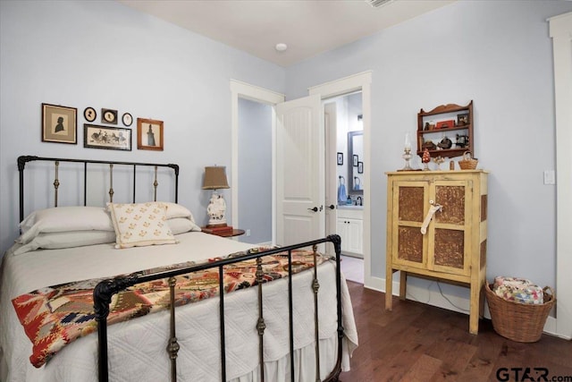 14621 Twin Pine Ln, Lindale, TX 75771 - bedroom featuring dark wood-style flooring and ensuite bath