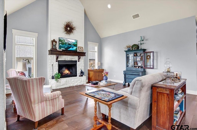 14621 Twin Pine Ln, Lindale, TX 75771 - living area featuring high vaulted ceiling, wood finished floors, and a stone fireplace