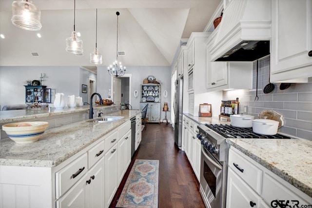 14621 Twin Pine Ln, Lindale, TX 75771 - kitchen with stainless steel appliances, premium range hood, lofted ceiling, dark wood-type flooring, and backsplash