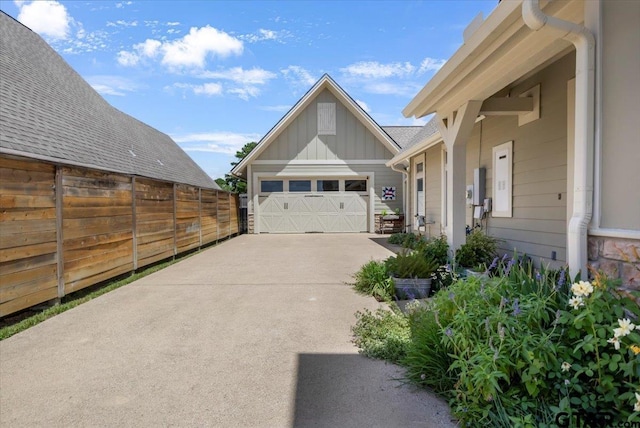 14621 Twin Pine Ln, Lindale, TX 75771 - view of home's exterior with board and batten siding, a garage, and concrete driveway
