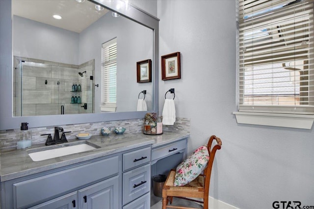 14621 Twin Pine Ln, Lindale, TX 75771 - bathroom with vanity, a shower stall, healthy amount of natural light, and decorative backsplash