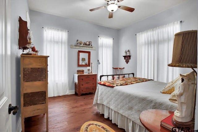 14621 Twin Pine Ln, Lindale, TX 75771 - bedroom featuring multiple windows, wood finished floors, and a ceiling fan