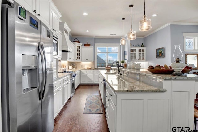 14621 Twin Pine Ln, Lindale, TX 75771 - kitchen featuring appliances with stainless steel finishes, ornamental molding, recessed lighting, white cabinetry, and glass insert cabinets