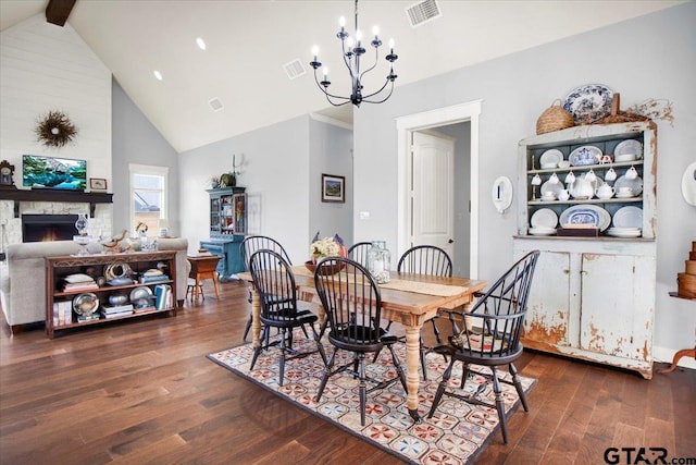 14621 Twin Pine Ln, Lindale, TX 75771 - dining area featuring dark wood-style flooring, a chandelier, high vaulted ceiling, a fireplace, and beam ceiling