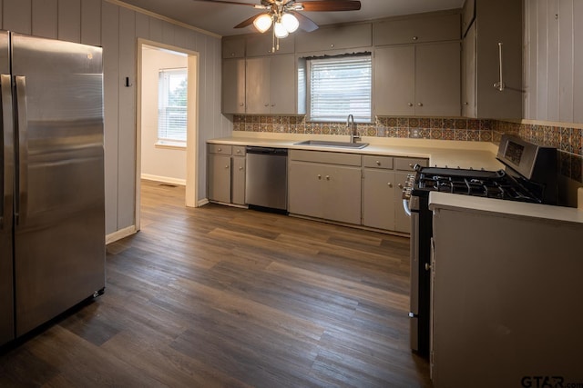 1400 Santa Rosa, Tyler, TX 75701 - kitchen with stainless steel appliances, backsplash, ceiling fan, dark wood-style flooring, and ornamental molding