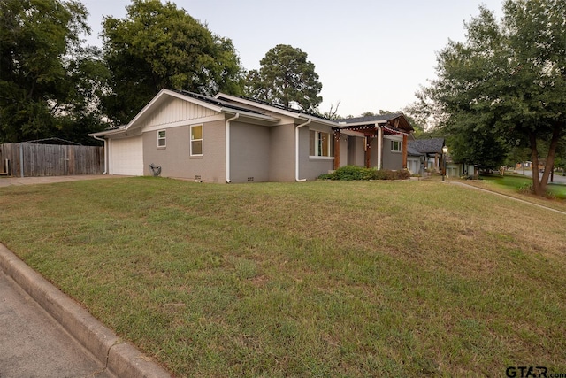 1400 Santa Rosa, Tyler, TX 75701 - view of front of house featuring an attached garage, concrete driveway, and brick siding