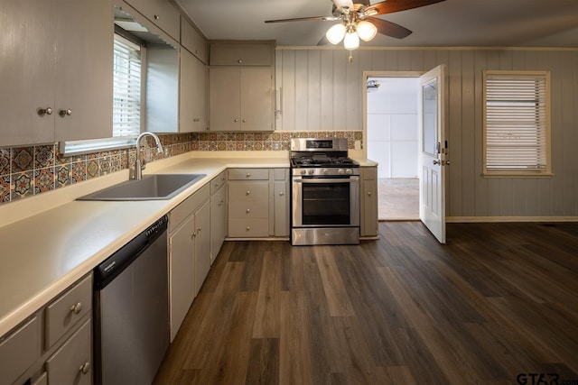 1400 Santa Rosa, Tyler, TX 75701 - kitchen with appliances with stainless steel finishes, backsplash, dark wood finished floors, a ceiling fan, and light countertops