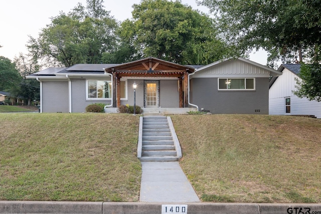1400 Santa Rosa, Tyler, TX 75701 - single story home featuring solar panels, brick siding, a front lawn, and covered porch