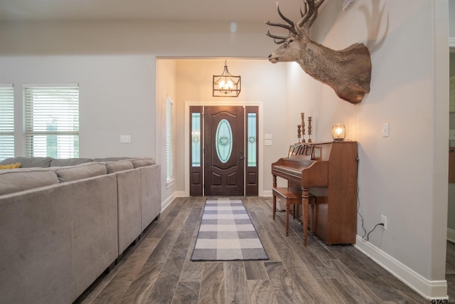 17294 Hidden Valley Ln, Flint, TX 75762 - foyer featuring a chandelier, dark wood-style flooring, and baseboards