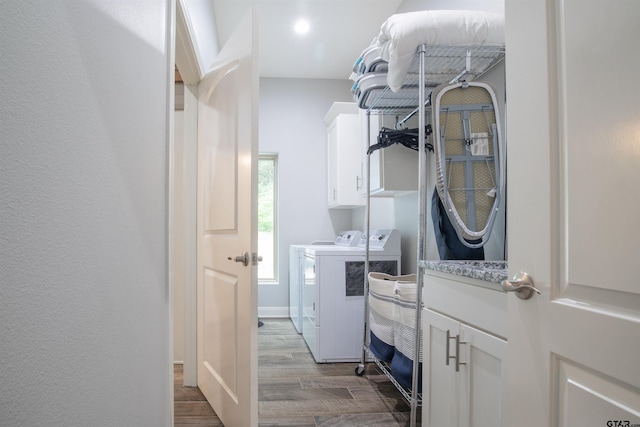 17294 Hidden Valley Ln, Flint, TX 75762 - laundry area with washing machine and clothes dryer, cabinet space, and wood finished floors