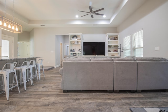 17294 Hidden Valley Ln, Flint, TX 75762 - living area with recessed lighting, a ceiling fan, a tray ceiling, and baseboards