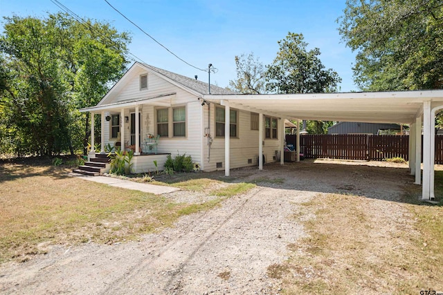 view of front of property with a carport and a porch