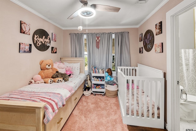 bedroom with carpet, ceiling fan, and crown molding