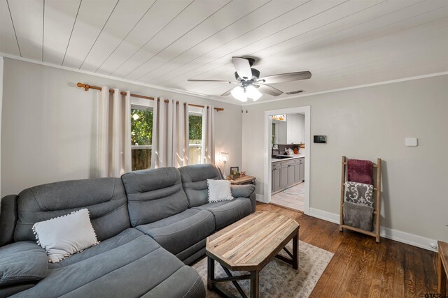 living room featuring ornamental molding, ceiling fan, sink, and dark hardwood / wood-style floors