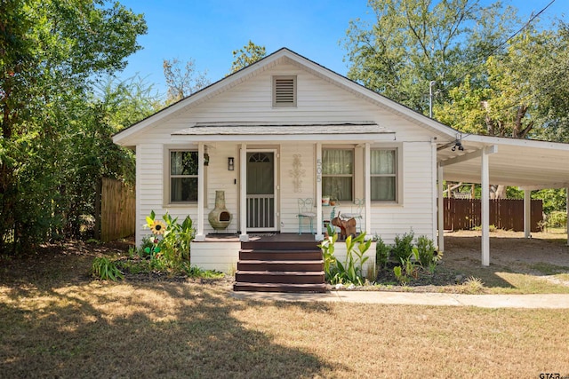 bungalow-style house with a front yard