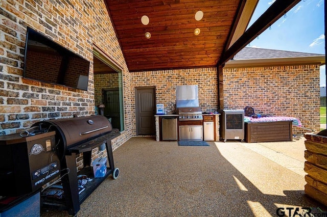 view of patio featuring exterior kitchen and area for grilling