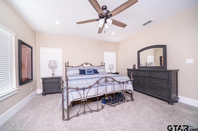 bedroom featuring light carpet, baseboards, visible vents, a ceiling fan, and recessed lighting