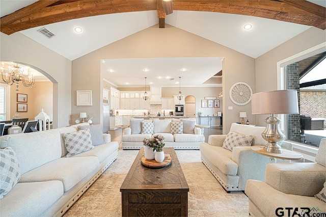 living room featuring arched walkways, a notable chandelier, visible vents, and vaulted ceiling with beams