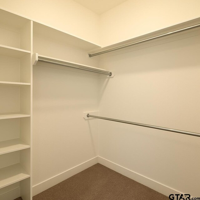 1057 Stagecoach Bnd, Bullard, TX 75757 - empty room featuring unfinished concrete flooring and baseboards