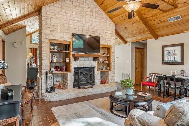 living area featuring wood ceiling, wood tiled floor, a fireplace, and visible vents