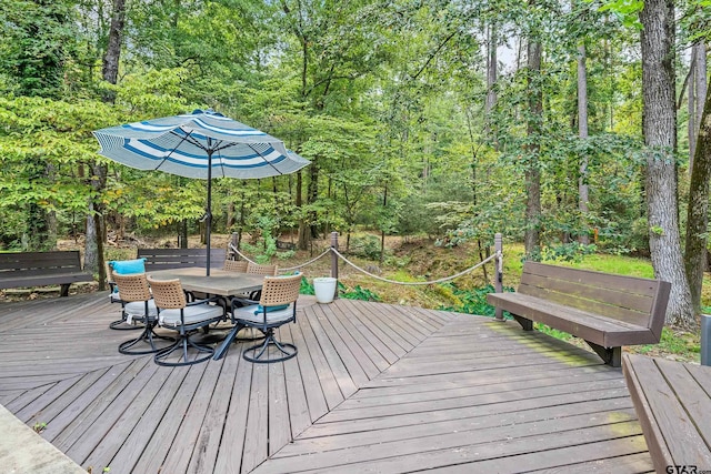 wooden deck featuring outdoor dining area