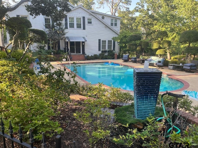 view of pool featuring a patio