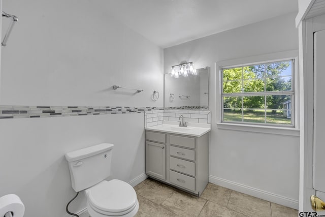 315 E Hubbard St, Lindale, TX 75771 - bathroom with toilet, tile patterned floors, and vanity