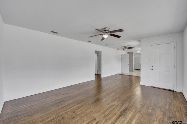 315 E Hubbard St, Lindale, TX 75771 - unfurnished room featuring a ceiling fan, wood finished floors, and baseboards