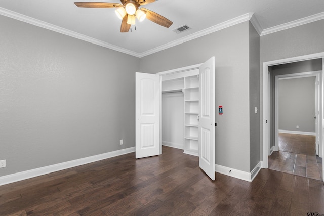 unfurnished bedroom featuring ceiling fan, dark hardwood / wood-style flooring, and ornamental molding