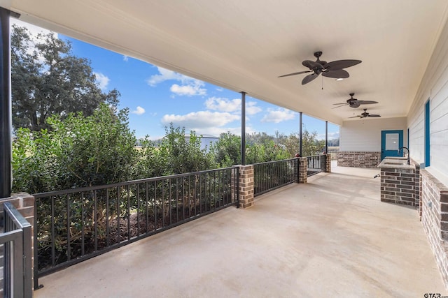 view of patio featuring ceiling fan