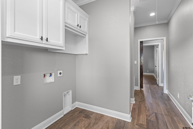 laundry room featuring dark wood-type flooring, hookup for a washing machine, electric dryer hookup, and crown molding