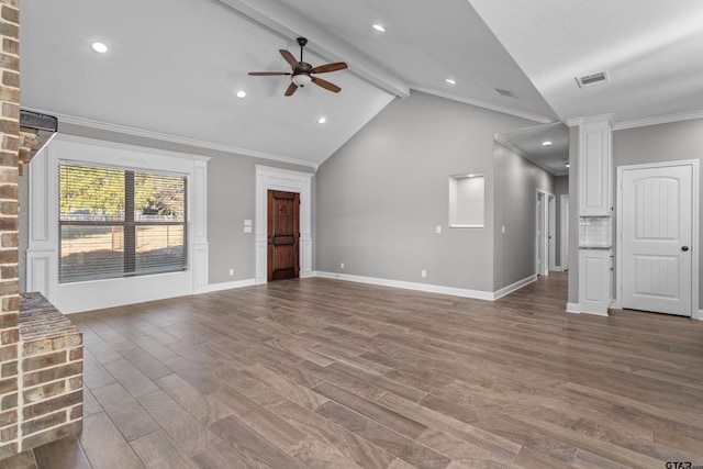 unfurnished living room with ceiling fan, wood-type flooring, vaulted ceiling with beams, and crown molding