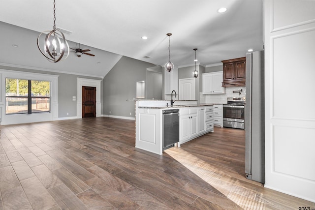 kitchen with white cabinetry, appliances with stainless steel finishes, ornamental molding, dark wood-type flooring, and vaulted ceiling