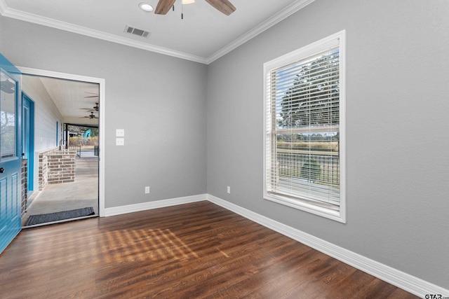 empty room featuring ornamental molding, dark hardwood / wood-style floors, and ceiling fan