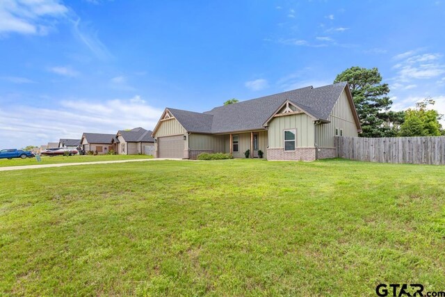 19308 Cedarpark Pl, Lindale, TX 75771 - view of front of property with an attached garage, board and batten siding, a shingled roof, driveway, and brick siding