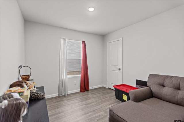 1106 Ripplewood Cir, Chandler, TX 75758 - sitting room with light wood finished floors and baseboards