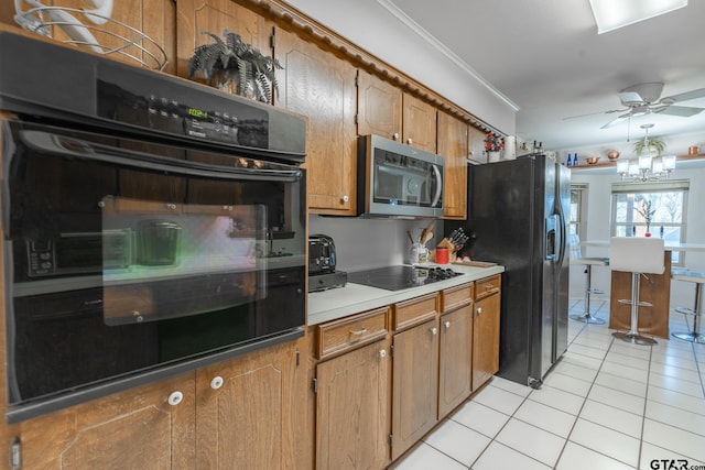 kitchen featuring crown molding, ceiling fan with notable chandelier, light tile patterned floors, and black appliances