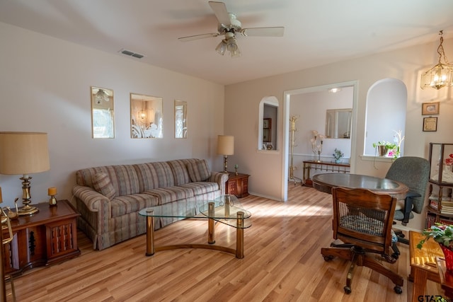 living room featuring ceiling fan and light wood-type flooring