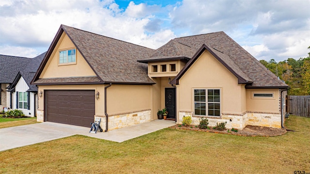 view of front facade with a garage and a front lawn