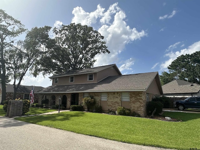 103 Paso Robles Trce, Bullard, TX 75757 - traditional home with brick siding, a front lawn, and roof with shingles