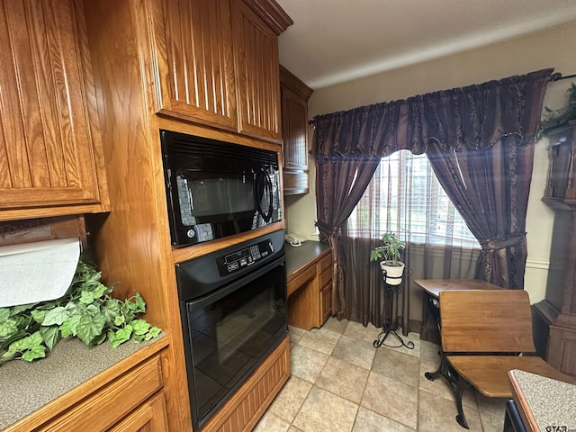 103 Paso Robles Trce, Bullard, TX 75757 - kitchen featuring black appliances, brown cabinets, and light stone finish flooring