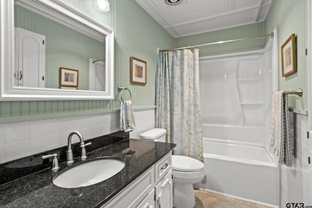 full bathroom featuring shower / tub combo with curtain, vanity, tile patterned floors, and toilet