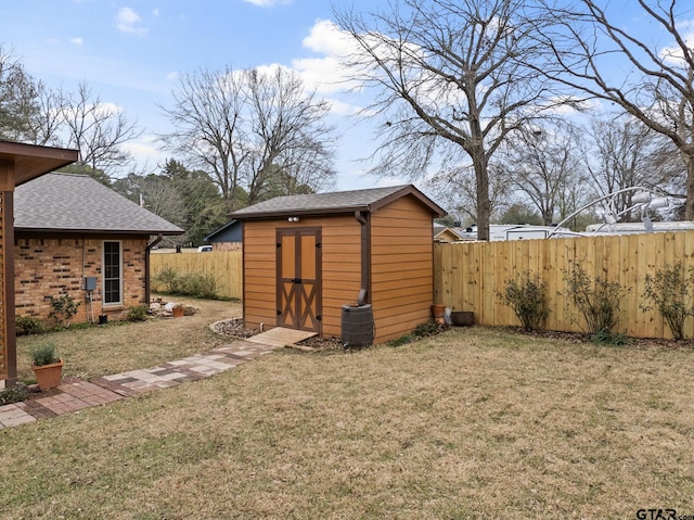 view of outbuilding with cooling unit and a lawn